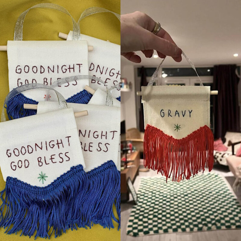 Two mini banner designs by embroidery artist Bianco Perry. One set features the stitched words Goodnight, God Bless. Blue tassels hang beneath it. The other design shows the word Gravy and has red hanging tassels.