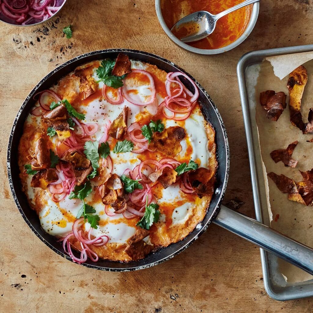 Ottolenghi's sweet potato shakshuka with sriracha butter and pickled onions