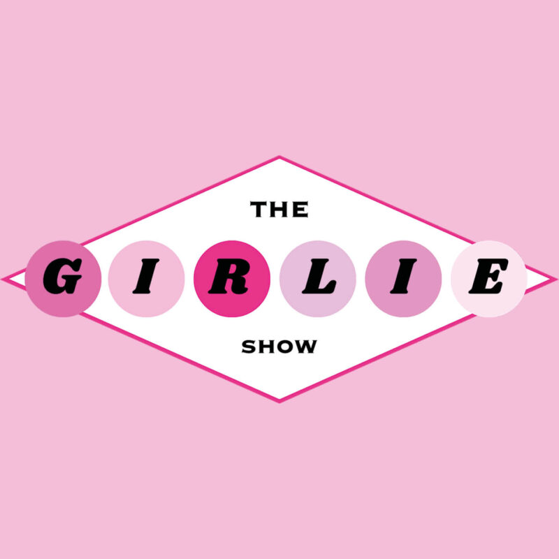 The Girlie Show logo displayed against a pink background.