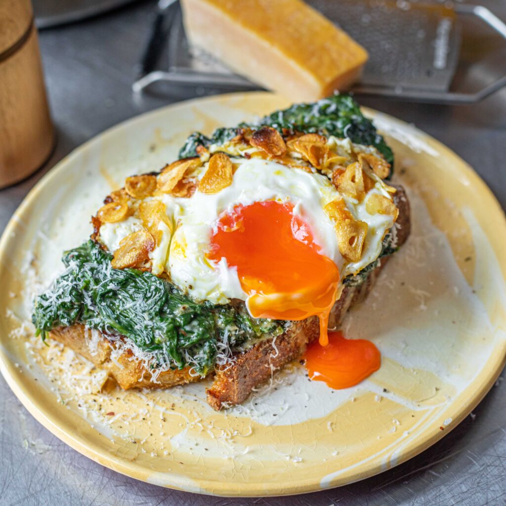 Spinach cacio e pepe toast