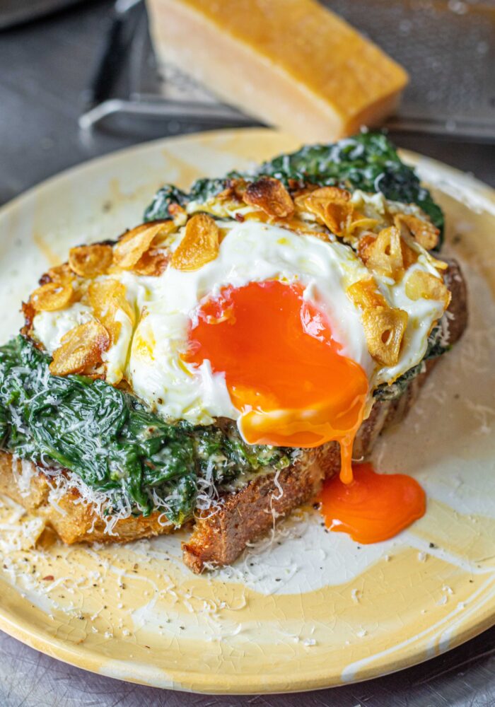 Spinach cacio e pepe toast