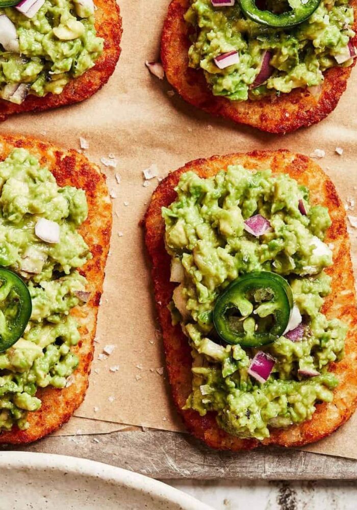 Spicy smashed avocado hash brown toasts