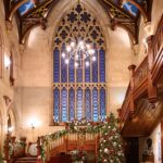 A great hall is beautifully decorated with garlands for the Christmas holidays
