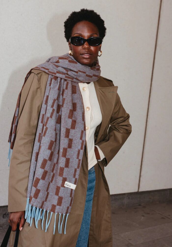 A three part header shows an image of two colourful cocktail glasses on the left. A stylish black model wearing a warm scarf in the middle and a plain backgroud with a coral coloured diary on the right.