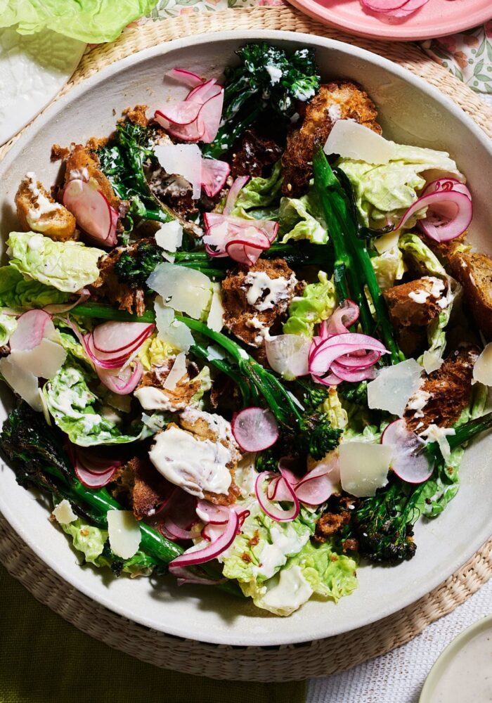 Charred broccoli salad with za’atar croutons, pickled radish and onions